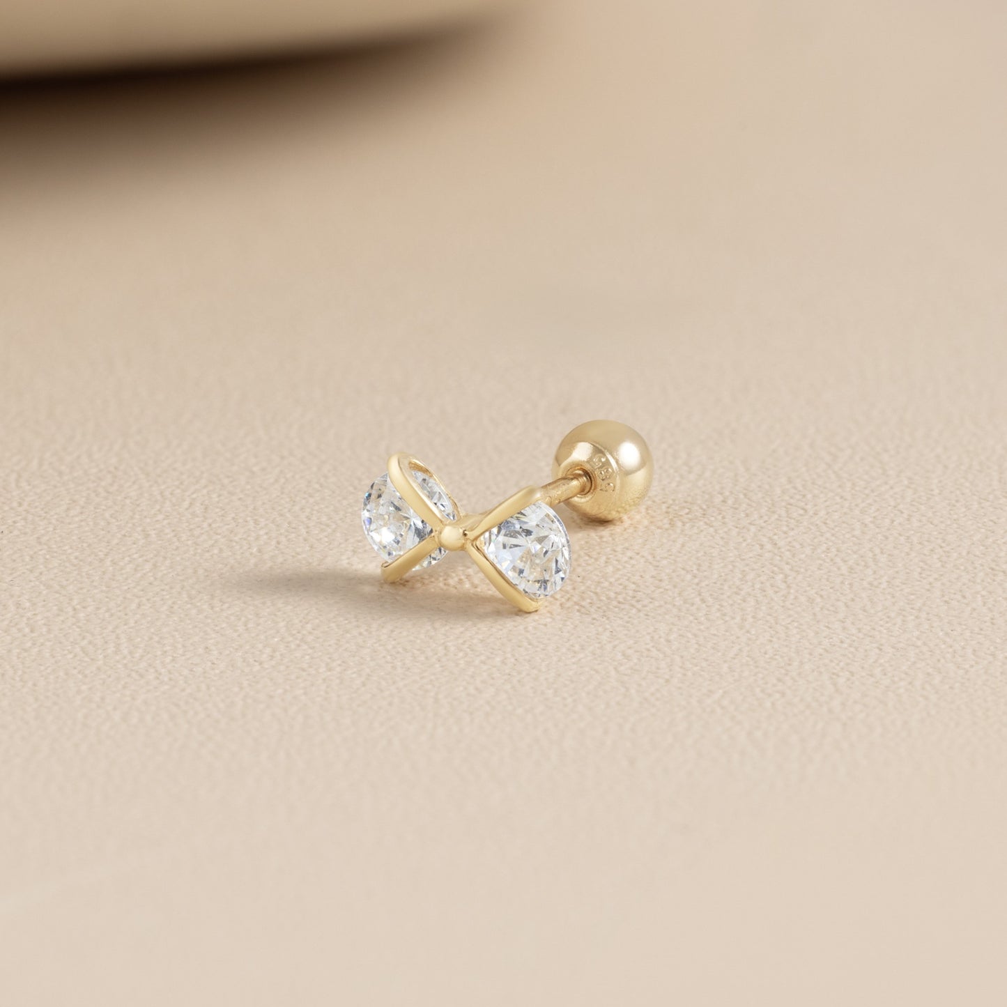 14K SOLID GOLD CUBIC BOW TIE PIERCING